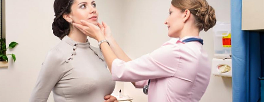 Doctor Checking Thyroid
